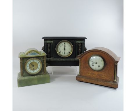 An onyx mantel clock, together with an Edwardian mantel clock and an early 20th century black painted mantel clock, 27cm tall