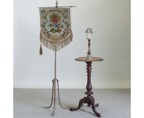A Victorian walnut lamp table, together with a 19th century pole screen 