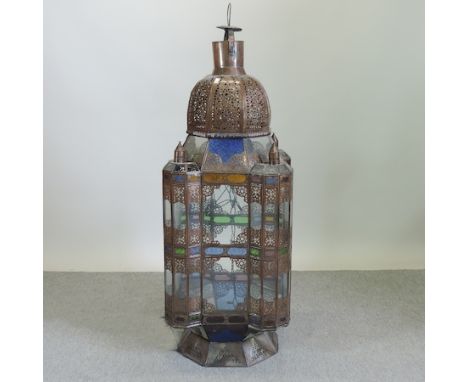 A Moroccan pierced metal and coloured glass hall lantern, of large proportions, 