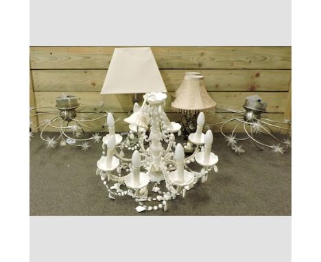 A contemporary white chandelier, together with a pair of modern chandeliers, a pair of table lamps a glass table lamp and sha
