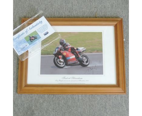 A signed photograph, First at Silverstone signed Troy Bayliss, with certificate, 21 x 29cm 