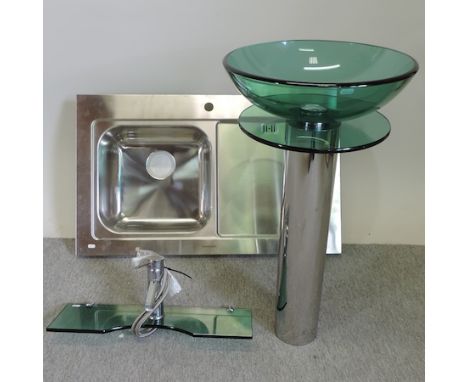 A modern chrome and glass wash basin, together with a matching tap and a stainless steel sink