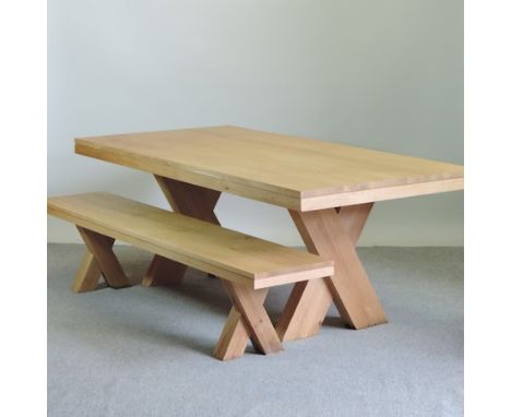 A light oak dining table, on an x-frame stretcher, 200 x 100cm, together with a matching bench 