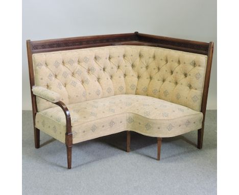 An Edwardian mahogany and cream upholstered button back corner sofa, 130cm