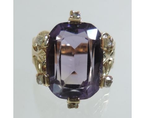 An 18 carat gold amethyst and diamond ring, boxed