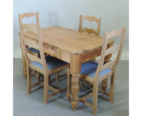 A pine dining table, 120 x 75cm, and a set of four ladder back chairs 