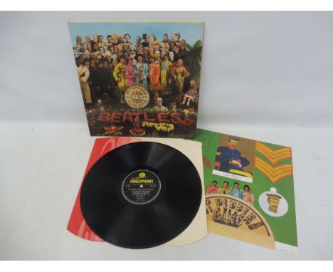 Beatles Sgt. Pepper's Lonely Hearts Club Band first press, G&amp;L laminated gate fold, visible flaps, gate fold sleeve, red 