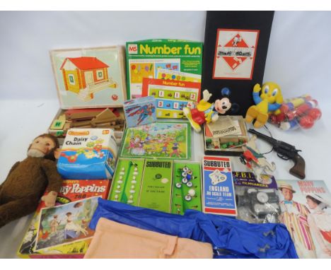 A box of original period toys including a straw-filled monkey, Subbuteo, Mary Poppins and others. 