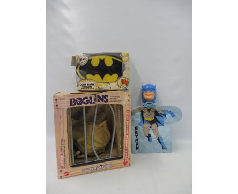 An original Boglins, Batman coin bank, and a Batman finger puppet.