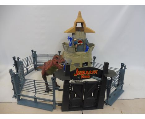 An original Kenner Jurassic Park Enclosure complete with large scale T-Rex, guns and figures. 