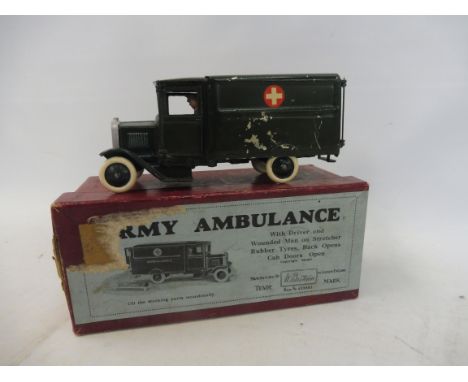 A boxed Britains Army Ambulance, no. 1512, complete with driver and wounded man on stretcher, model with some overpainting, n