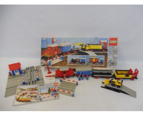 A boxed Lego 7720 Diesel Freight Train Set, 1980, no instructions, not checked, box poor, plus an unboxed Lego 7834 Level Cro