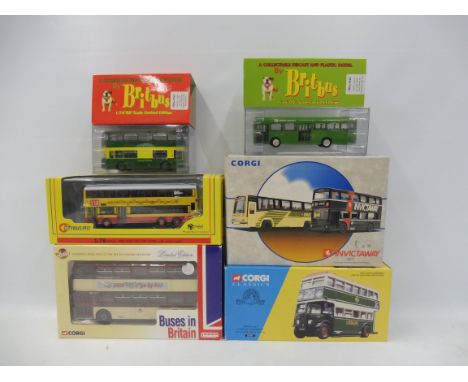 A quantity of boxed Corgi buses, and others.