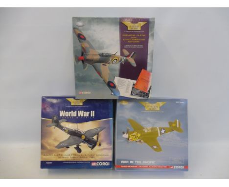 Three boxed Corgi Aviation Archive models, Hurricane Mk.1, Curtis P40 war hawk and a Junkers JU87 Stuka.
