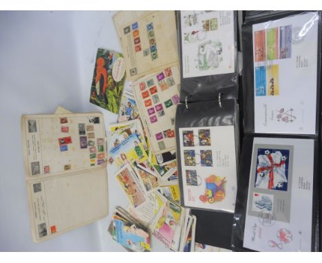 A quantity of first day covers, cigarette cards and period novelty postcards.