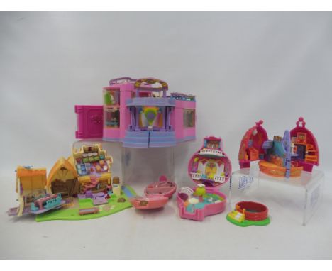 Seven vintage Polly Pocket playsets marked Bluebird Swindon England.