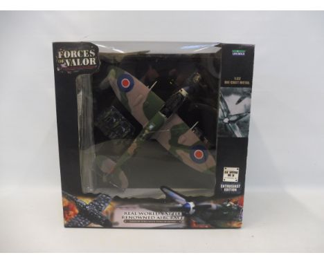 A 1:32 scale Forces of Valour model, Spitfire Mk.IX 1945.