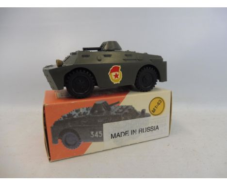 A 1:43 scale die-cast BRDM-2 scout vehicle, with spinning turret, made in the USSR.