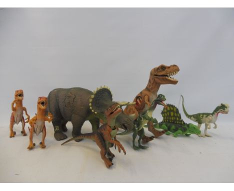 A selection of Jurassic Park dinosaurs to include a large scale triceratops. 