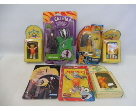 A selection of carded figures to include mupppets, cabbage patch kids etc.