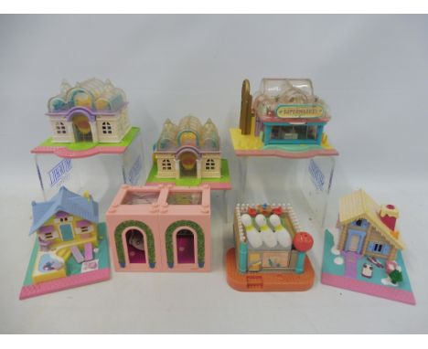 Seven vintage Polly Pocket playsets marked Bluebird Swindon England.