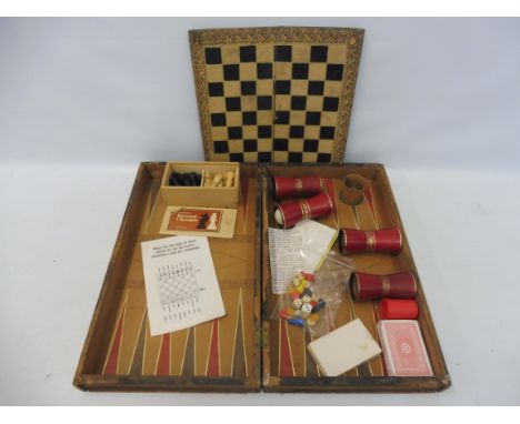 A games compendium including backgammon, dice, leather shakers etc.