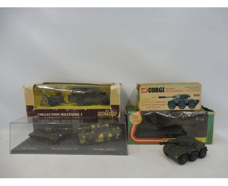 A part boxed Corgi Saladin armoured car, a boxed Chieftan tank, a boxed Solido Land Rover set and boxed war gaming USA and Ge