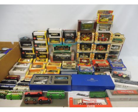 Four boxes of mixed die-cast models including small scale Burago, also some reference books.