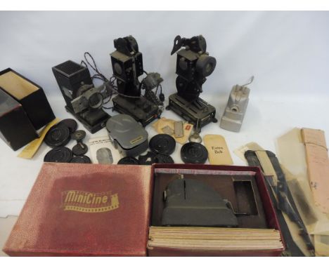 A box of early projectors including Pathescope, Baby Projector, cased Minicine etc.