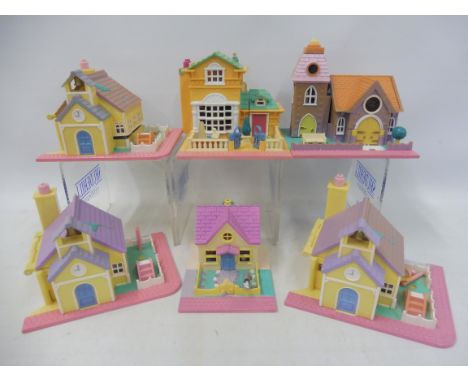 Seven vintage Polly Pocket house playsets marked Bluebird Swindon England.