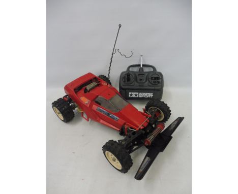 A Tamiya Super Sabre 58066 1/10th scale electric remote controlled buggy on a Boomerang chassis, circa 1987 plus an AD Spec. 