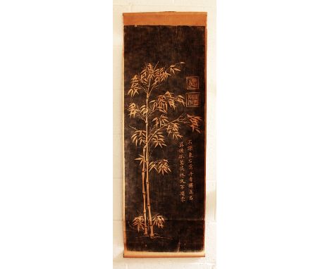 A CHINESE HANGING SCROLL PICTURE, decorated with calligraphy, seals and bamboo reserved on a black ground, the picture itself