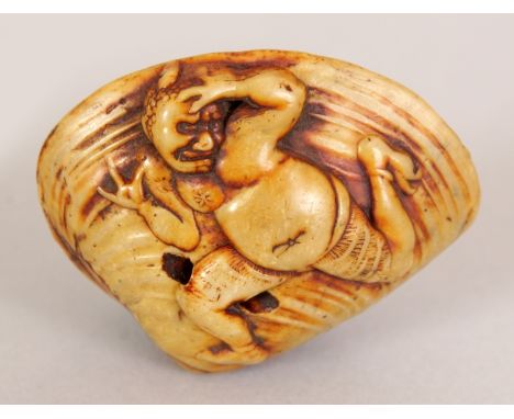 A JAPANESE MEIJI PERIOD IVORY STYLE SHELL NETSUKE, its underside surface carved with Okame, the upper surface with a fleeing 