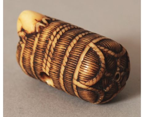 A GOOD QUALITY JAPANESE MEIJI PERIOD IVORY NETSUKE OF A RAT ON A STRAW BALE, unsigned, the rat burrowing its head into the ro