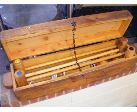 A vintage croquet set in wooden box 