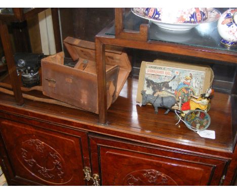 An antique clockwork horse and cart by Lehmann's with box, together with a cased Theodolite