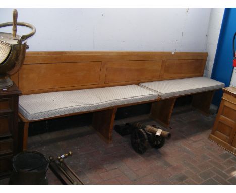 A 280cm long pew with padded seat