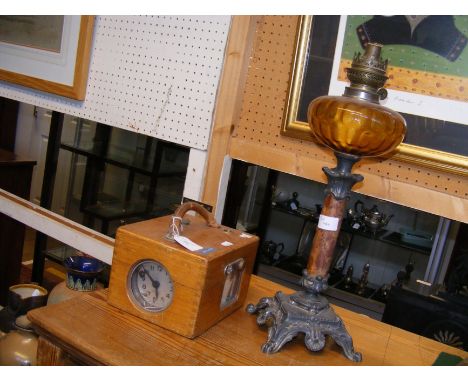 An antique oil lamp together with a pigeon racing clock?
