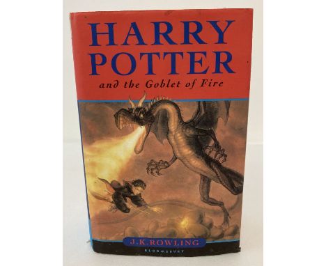 A hardback copy of "Harry Potter and the Goblet of Fire" by J.K. Rowling, printed by Omnia Books. Edition has original mistak