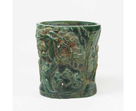 A Chinese carved stone brush pot, decorated with trees and figures, 16cm high