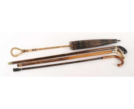 An early 20th century antler handled walking stick, 80cm long, together with two others, and a parasol, 94cm (4)largest 94cm