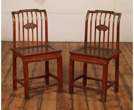A pair of Chinese stick back chairs, the backs decorated with fans (2)height 94cm, seat height 51 cm