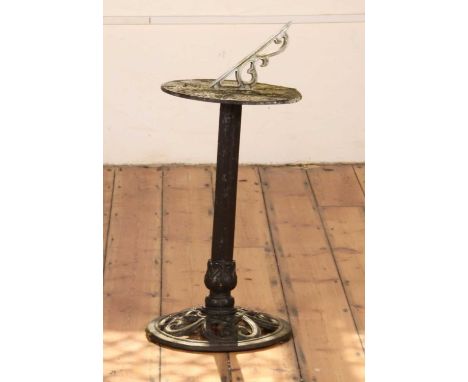 A garden sundialheight of stand 64cm, 36cm diameter