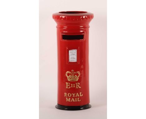 A modern red painted cast metal novelty stick stand, in the form of a post box, 51cm high