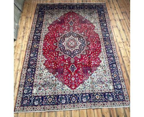 A Persian Tabriz carpet, having a large central medallion, on a foliate ground360 x 255cm