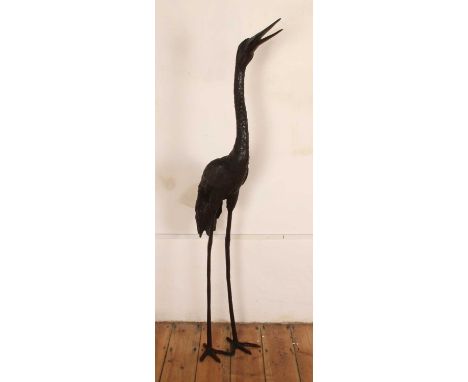 An extremely large modern bronze garden sculpture of a crane bird, in a standing pose with head raised, height168cm