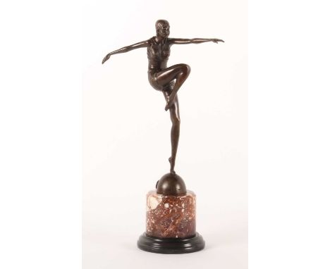 An Art Deco style modern bronze figure of a dancer, on one leg, on a circular marble base, 55cm high