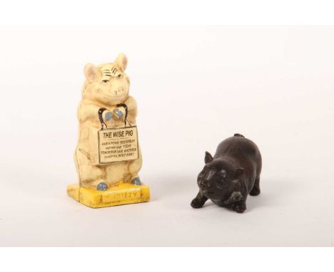 A painted cast iron The Wise Pig money box, together with a bronze model of a pig (2)money box h. 15cm, bronze pig l. 13cm, h