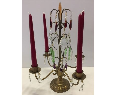 Vintage metal 4 arm candelabra decorated with different coloured crystal chandelier drops.  