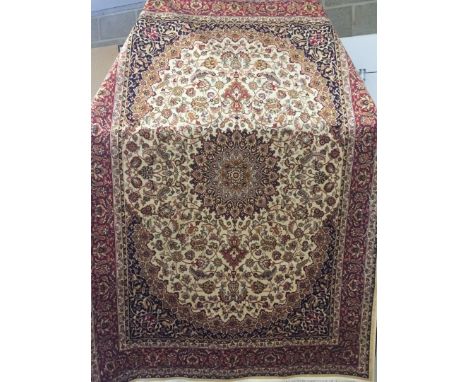 A Keshan ground carpet. Beige colour. With dark red, navy blue and gold design. Approx 230 x 160cm. 